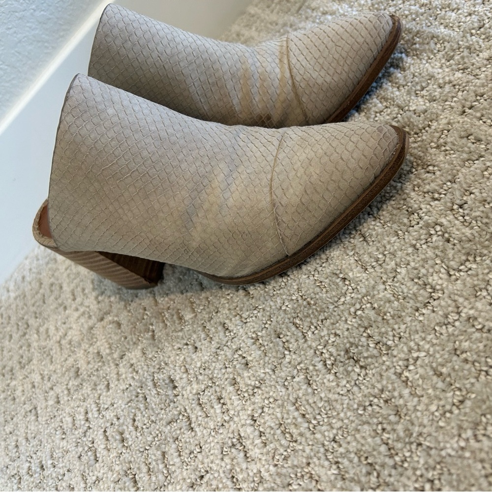 Woman’s grey ankle boot.